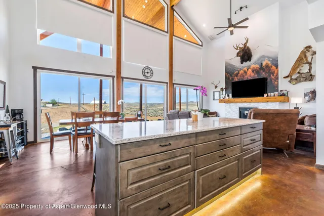 a very nice looking living room with furniture and a large window