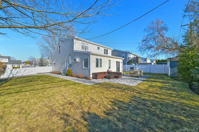 a swimming pool view with a outdoor seating