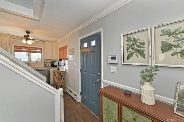 a view of room with furniture and wooden floor