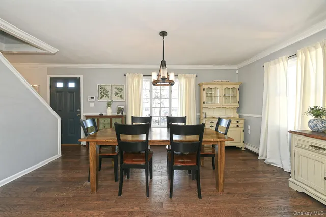 a dining room with furniture window wooden floor