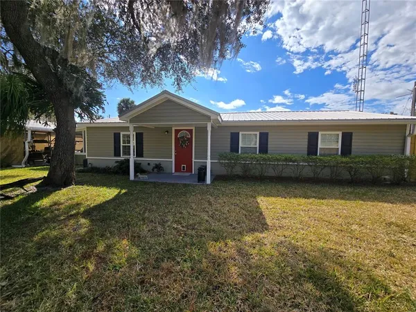 front view of a house with a yard