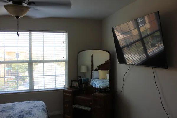 a room with furniture and mirror