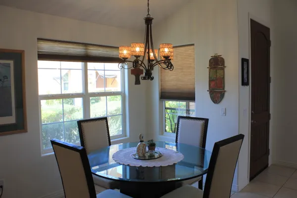 a kitchen with a dining table and chairs