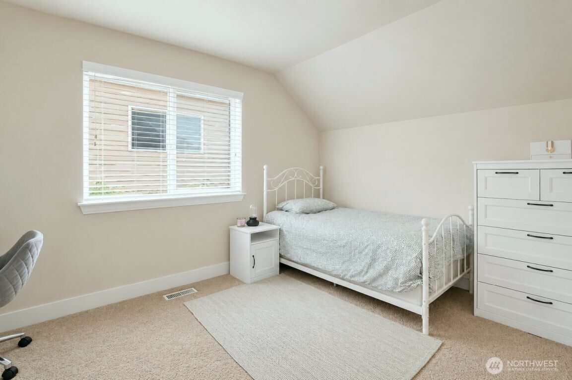 19607 25th Drive Southeast Bothell, WA 98012 - Photo 25 of 30 a bedroom with a bed and a window