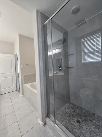 a white bath tub sitting in a bathroom