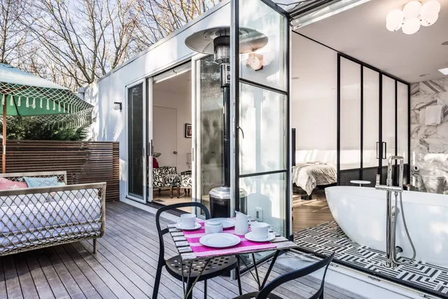 a bedroom with a bed and a painting on the wall