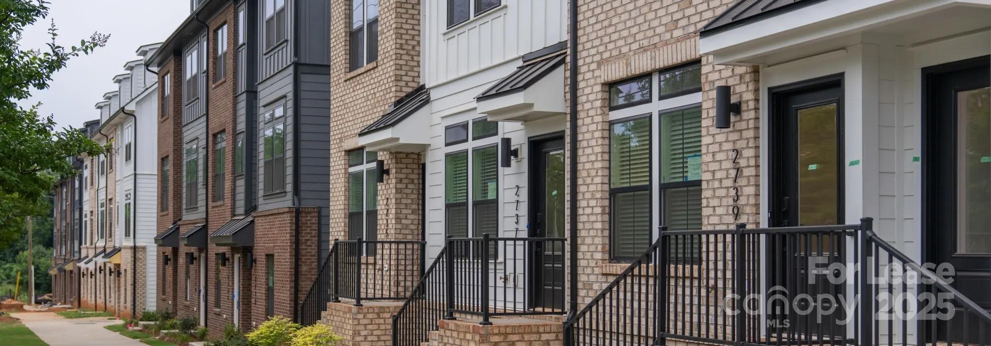2721 Rozzelles Ferry Road Charlotte, NC 28208 - Photo 3 of 25 a view of a building with a glass door