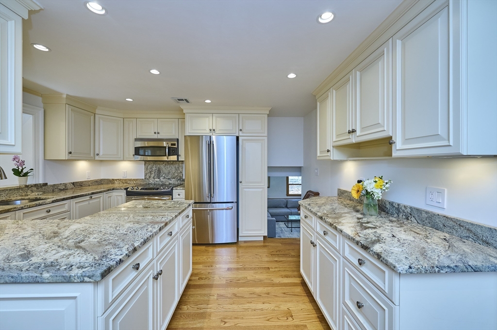 42 Troutbrook Road Dover, MA 02030 - Photo 12 of 36 a kitchen with stainless steel appliances granite countertop a stove sink and cabinets
