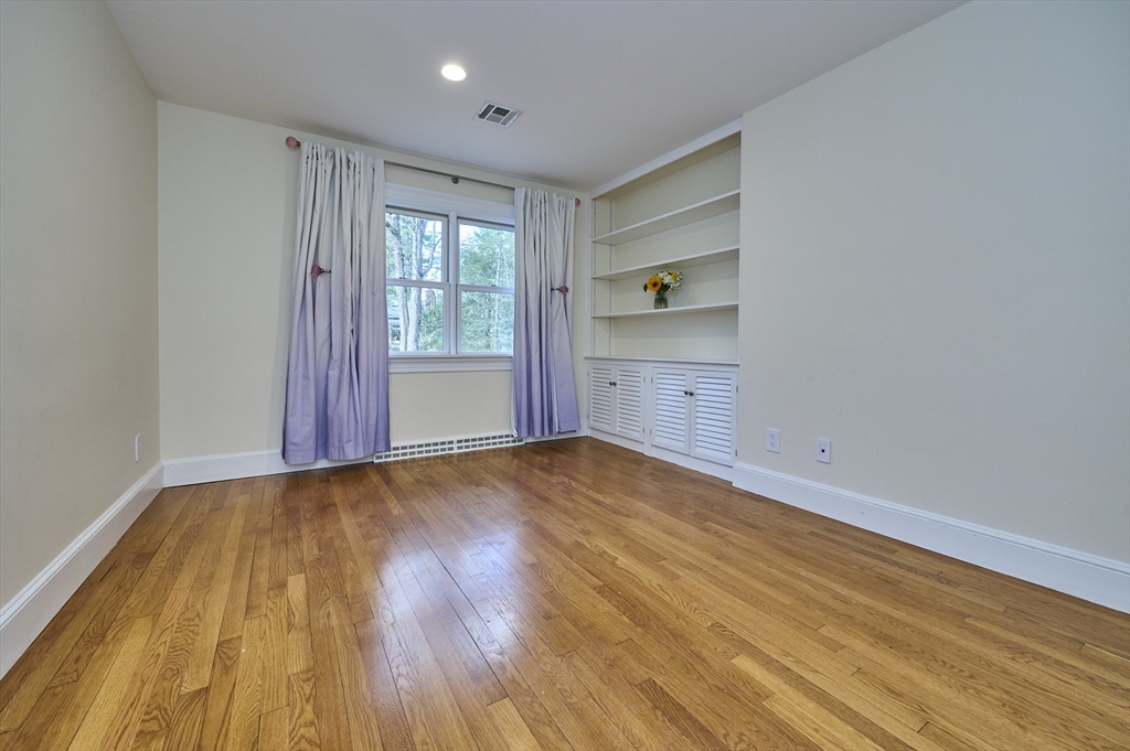 42 Troutbrook Road Dover, MA 02030 - Photo 20 of 36 a view of empty room with wooden floor and window