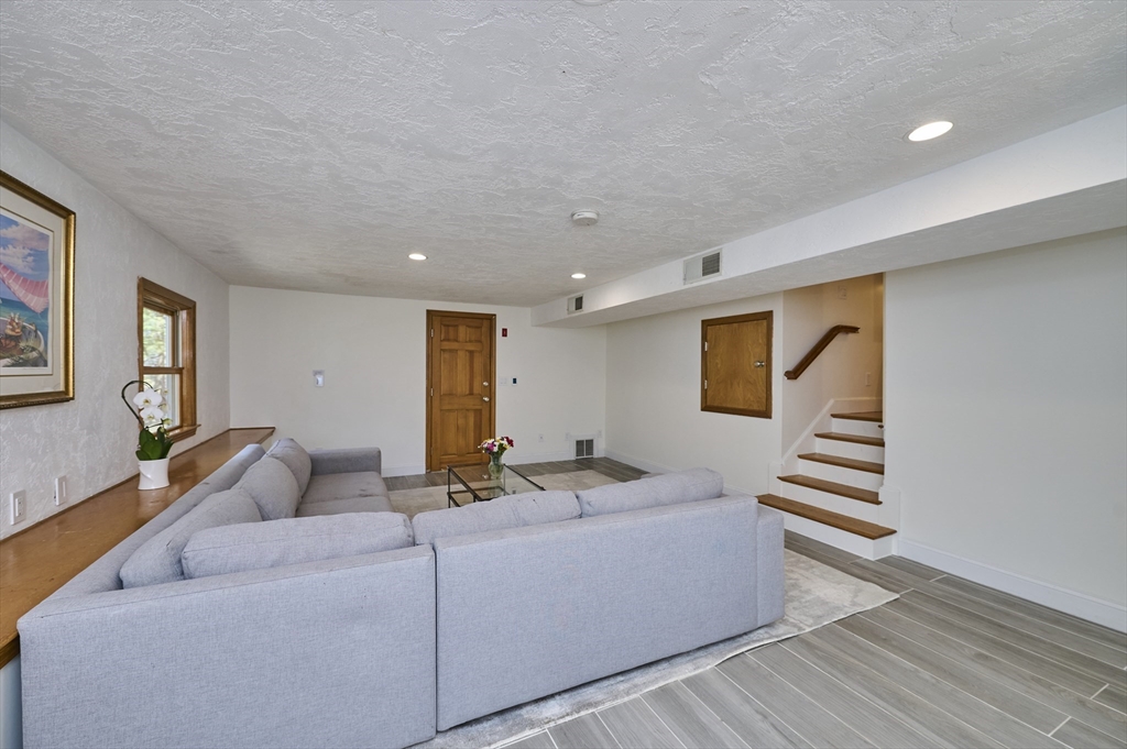 42 Troutbrook Road Dover, MA 02030 - Photo 27 of 36 a living room with furniture and wooden floor