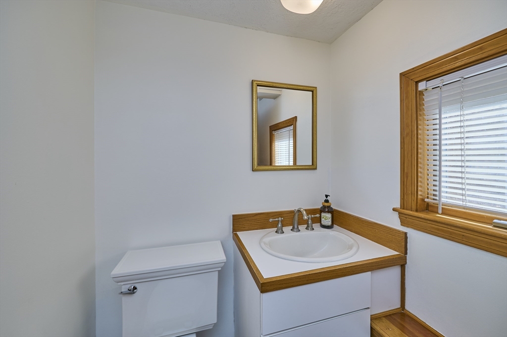 42 Troutbrook Road Dover, MA 02030 - Photo 30 of 36 a bathroom with a sink toilet and vanity