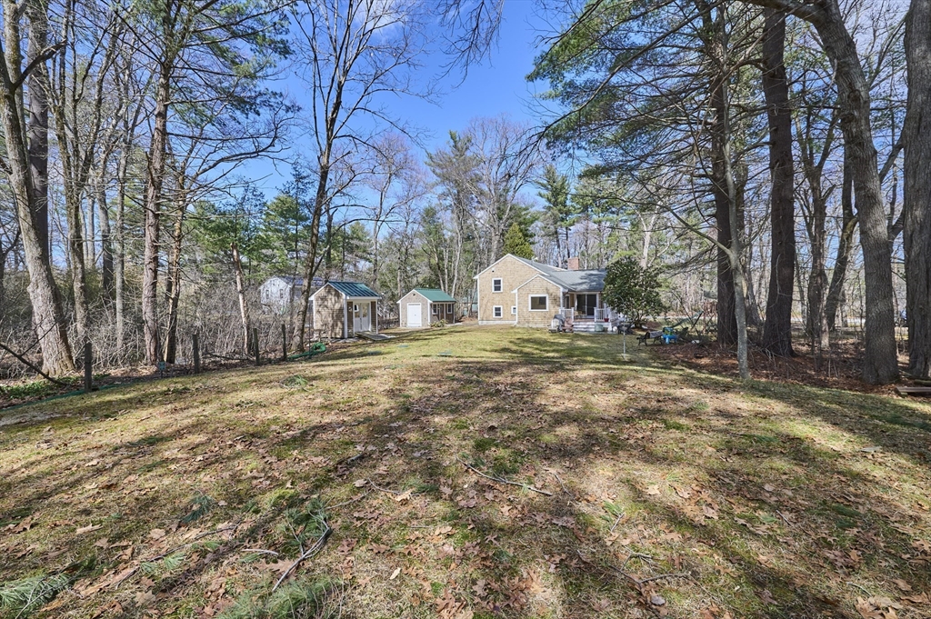42 Troutbrook Road Dover, MA 02030 - Photo 32 of 36 a view of a yard with yellow house