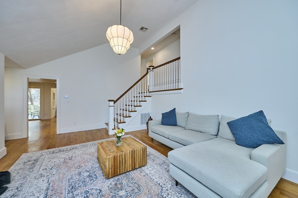 42 Troutbrook Road Dover, MA 02030 - Photo 5 of 36 a living room with furniture chandelier and a rug
