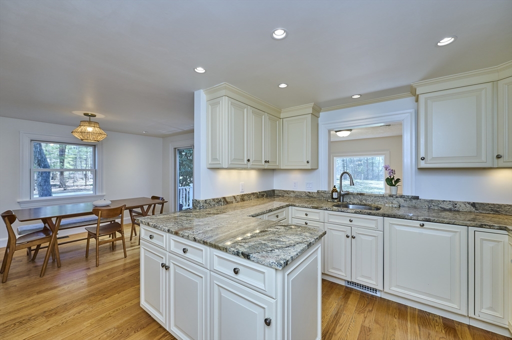 42 Troutbrook Road Dover, MA 02030 - Photo 10 of 36 a kitchen that has a lot of cabinets in it and wooden floors
