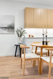 a view of a kitchen with kitchen island table and chairs