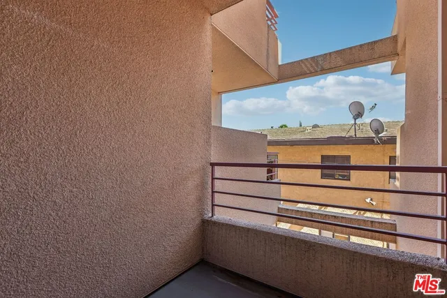 a kitchen with stainless steel appliances granite countertop a refrigerator and a stove