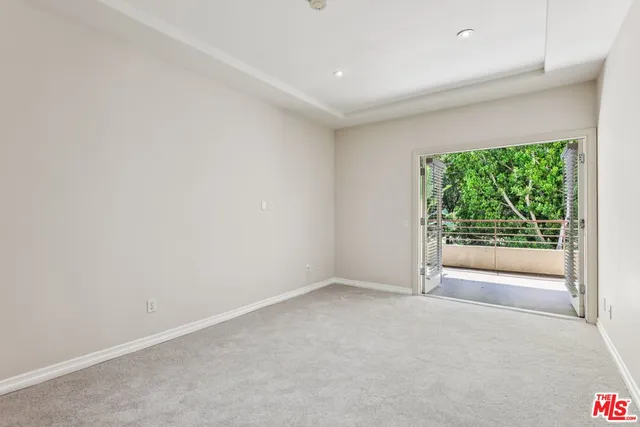 a bathroom with a granite countertop sink a mirror and a shower