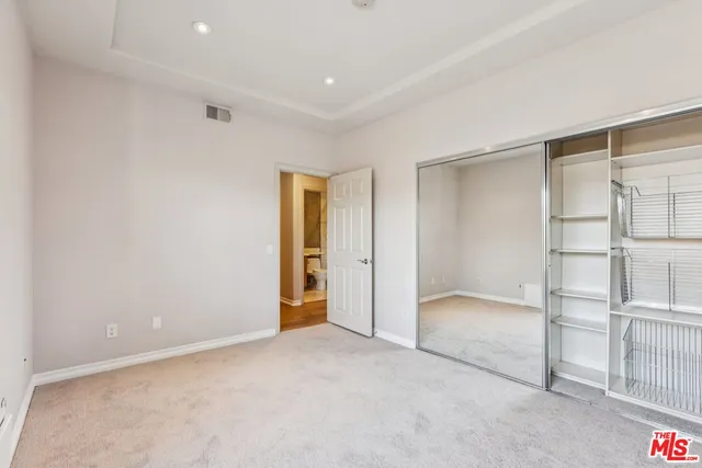 a bathroom with a sink toilet a mirror and shower