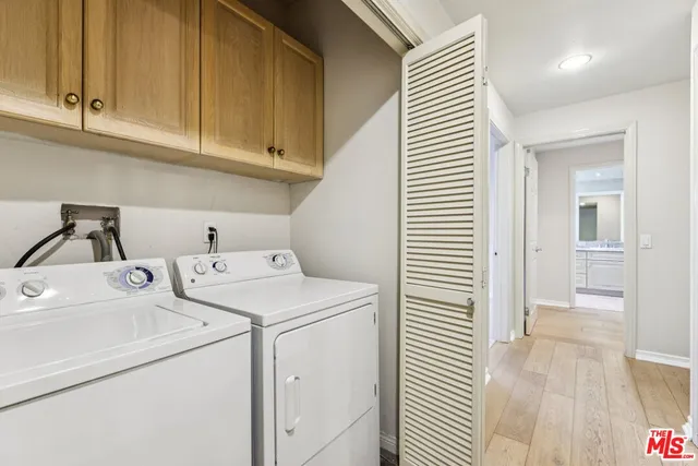 a bedroom with a large bed and a fireplace