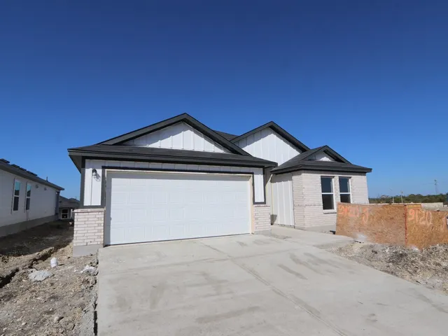 a view of white house with a yard