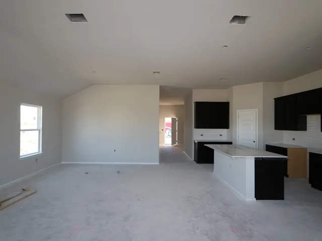 a view of an empty room with a flat screen tv