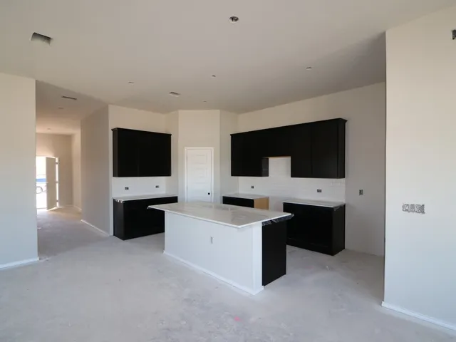 a kitchen with stainless steel appliances a sink and a microwave