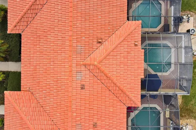 a view of a patio with a table and chairs under an umbrella