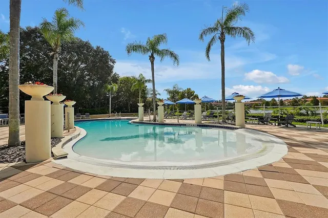 a view of a patio with table and chairs and potted plants