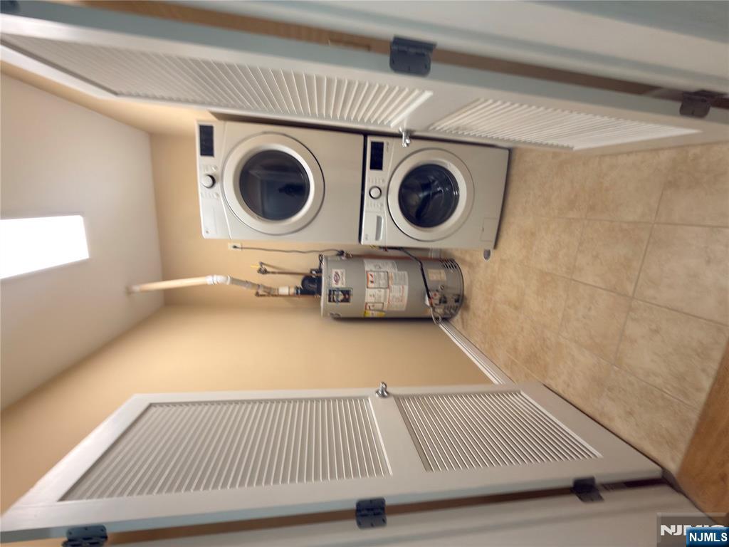 725 River Road, Unit 1B New Milford, NJ 07646 - Photo 2 of 9 a utility room with dryer and washer