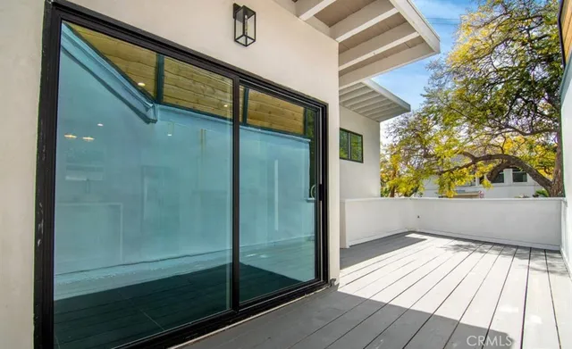 a bathroom with a glass shower door