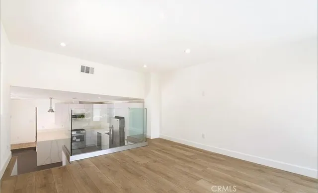 a view of a livingroom with wooden floor