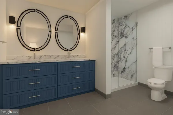 a bathroom with a toilet a sink and a mirror