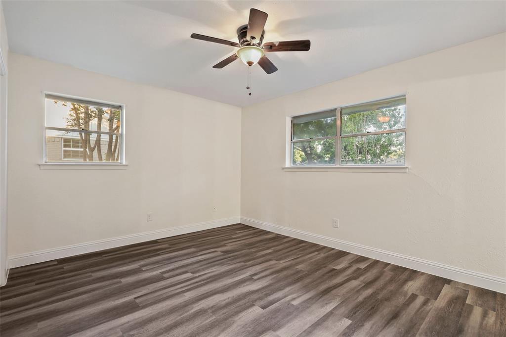 3126 Jubilee Trail Dallas, TX 75229 - Photo 16 of 38 a view of empty room with wooden floor and fan