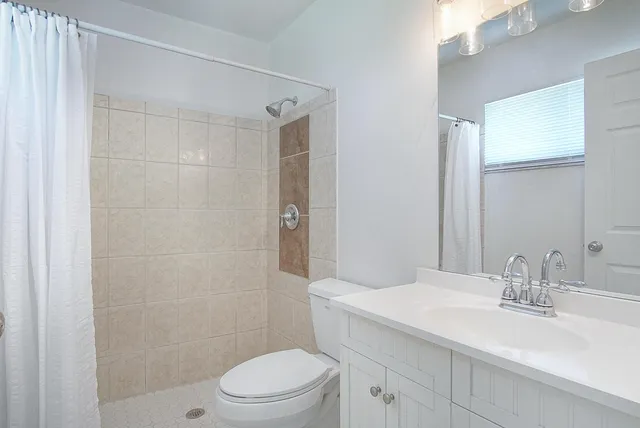 an aerial view of residential houses with outdoor space and swimming pool