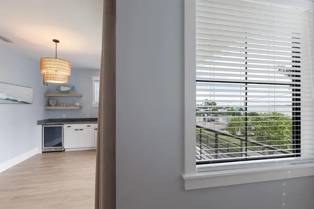 a bedroom with a large bed and a large window