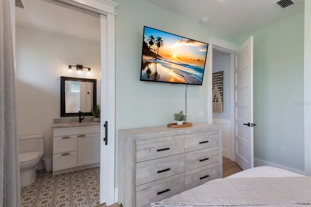 a view of a lake with couches in the background