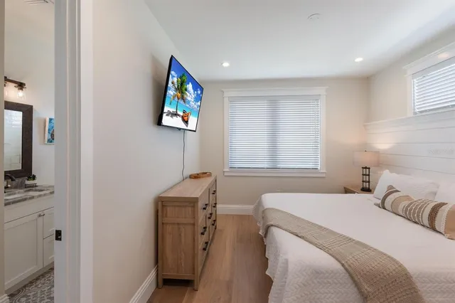 a view of a patio with a table chairs and a backyard