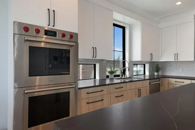 a dining room with furniture a rug and wooden floor
