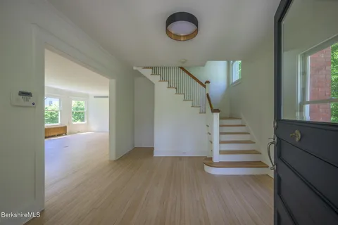 a view of entryway with wooden floor
