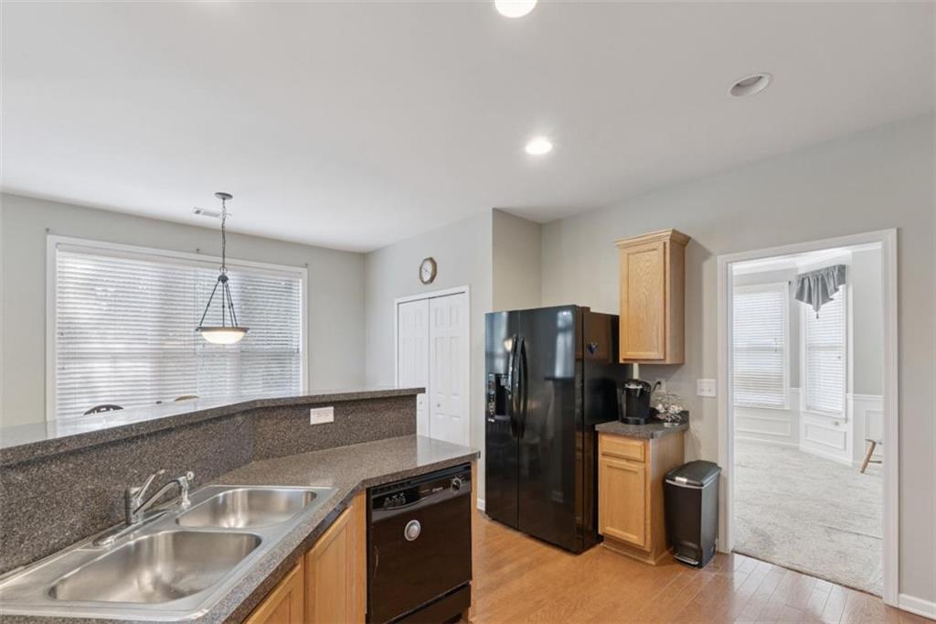 2747 High Creek Run Dacula, GA 30019 - Photo 16 of 48 a kitchen with refrigerator and sink