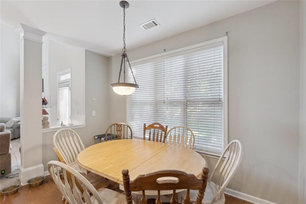 2747 High Creek Run Dacula, GA 30019 - Photo 20 of 48 a view of a dining room with furniture