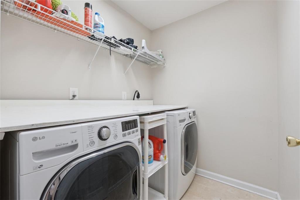 2747 High Creek Run Dacula, GA 30019 - Photo 45 of 48 a utility room with dryer and washer