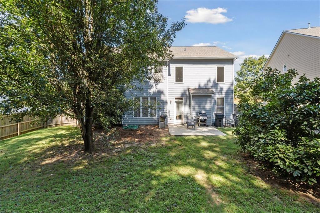 2747 High Creek Run Dacula, GA 30019 - Photo 47 of 48 a view of a house with backyard and sitting area