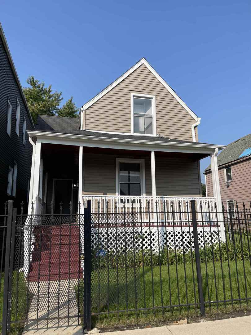 7246 South Morgan Street Chicago, IL 60621 - Photo 1 of 1 a front view of a house with a balcony