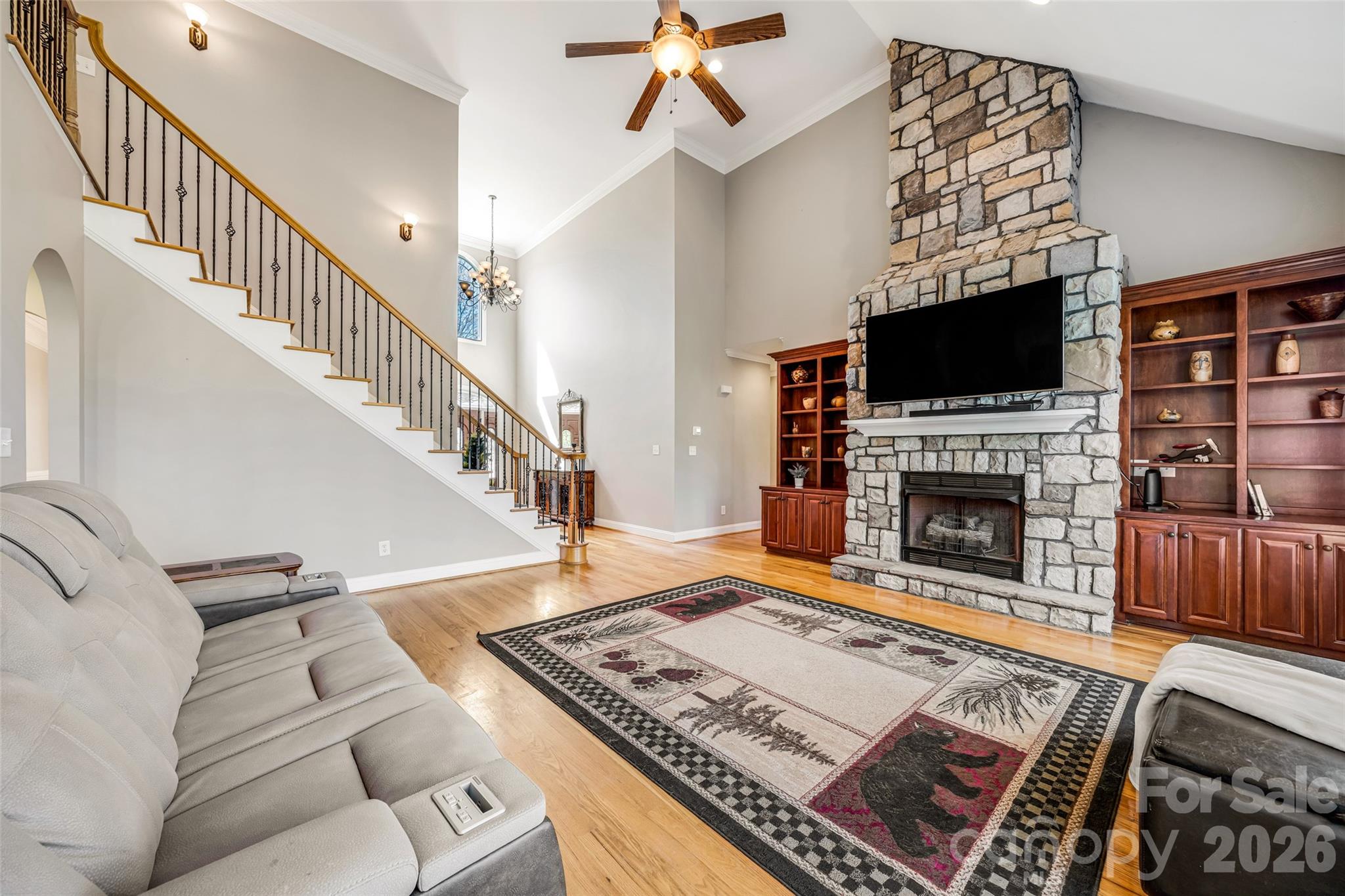 5873 Bakers Point Hickory, NC 28602 - Photo 15 of 48 a living room with furniture a flat screen tv and a fireplace