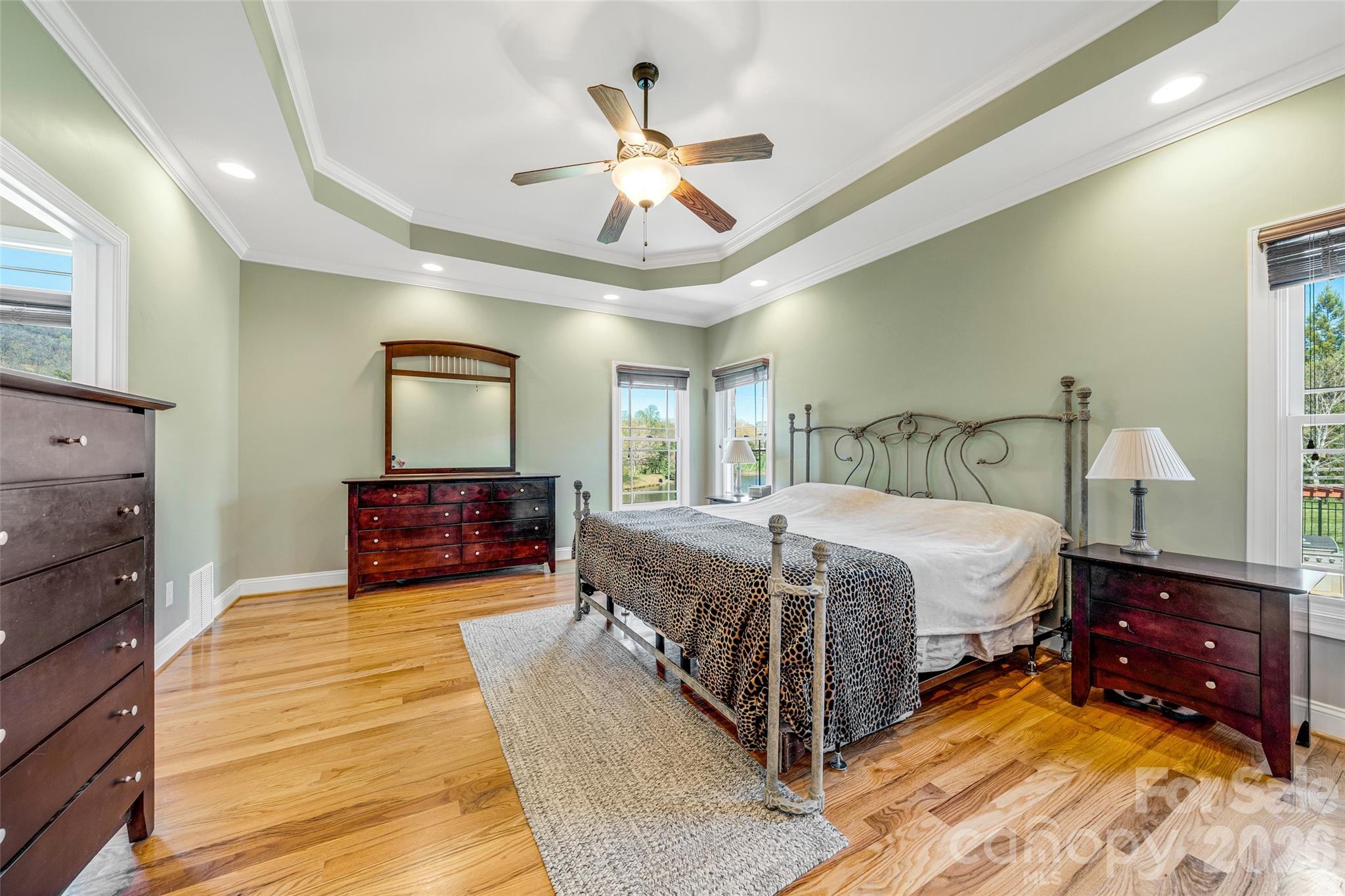 5873 Bakers Point Hickory, NC 28602 - Photo 17 of 48 a spacious bedroom with a bed and a ceiling fan