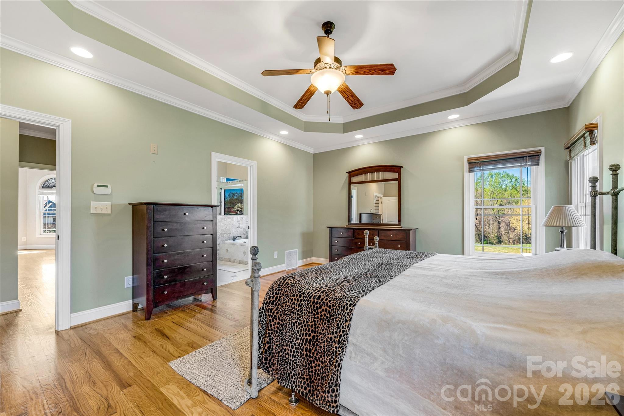 5873 Bakers Point Hickory, NC 28602 - Photo 18 of 48 a spacious bedroom with a bed and a chandelier