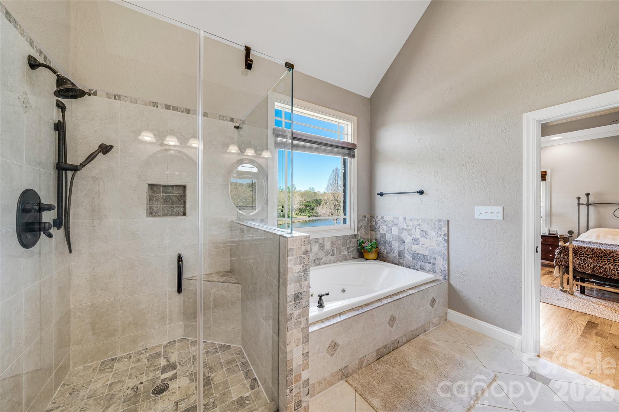 5873 Bakers Point Hickory, NC 28602 - Photo 19 of 48 a bathroom with a bathtub and a shower