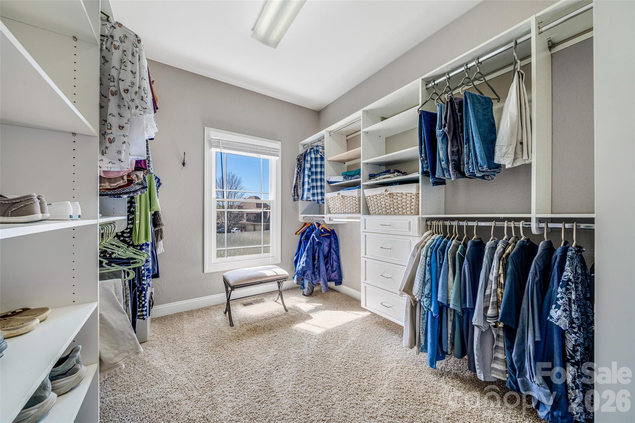 5873 Bakers Point Hickory, NC 28602 - Photo 22 of 48 a view of walk in closet with clothes and shoes