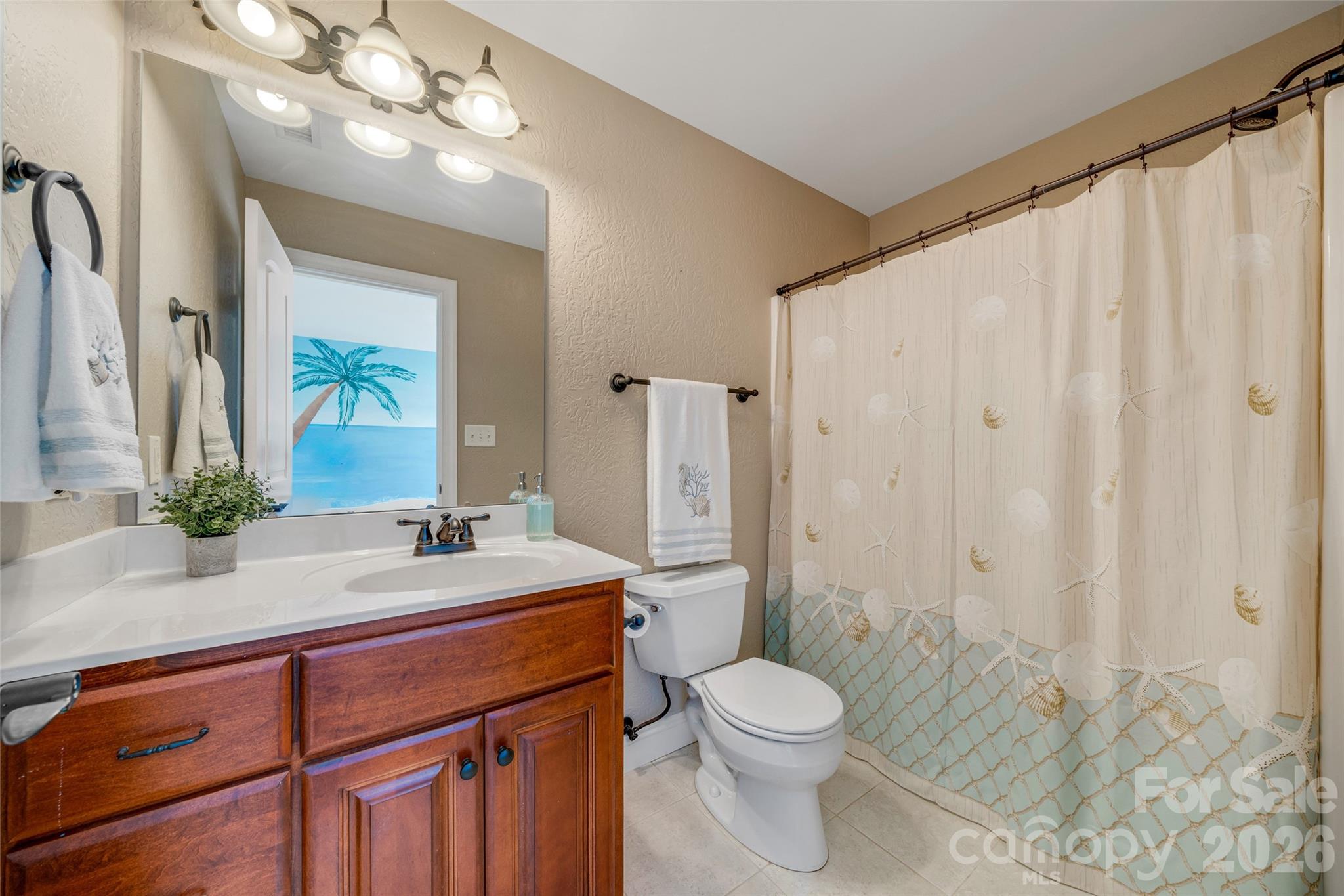 5873 Bakers Point Hickory, NC 28602 - Photo 28 of 48 a bathroom with a toilet a sink and a mirror